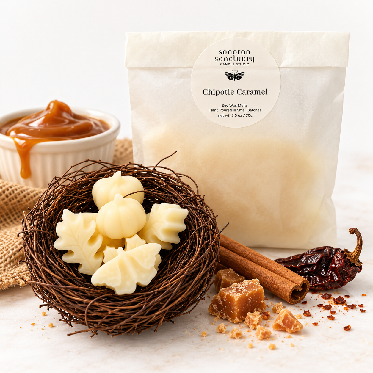Sonoran Sanctuary Chipotle Caramel wax melts in branded packaging with botanical-shaped wax melts, caramel sauce, cinnamon sticks and dried chipotle peppers