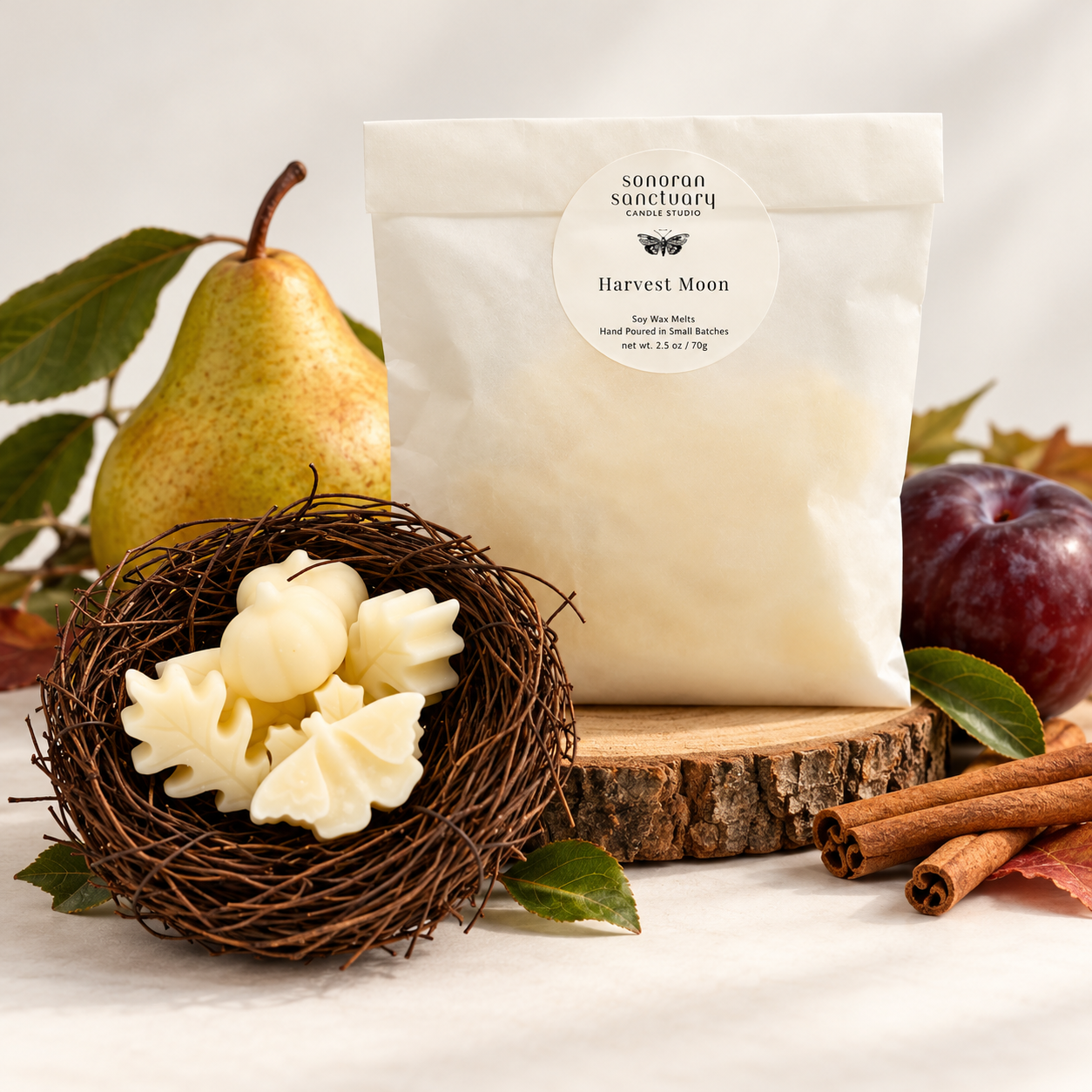 Sonoran Sanctuary Harvest Moon wax melts in branded packaging with botanical-shaped wax melts, fresh pear, ripe plum and cinnamon sticks