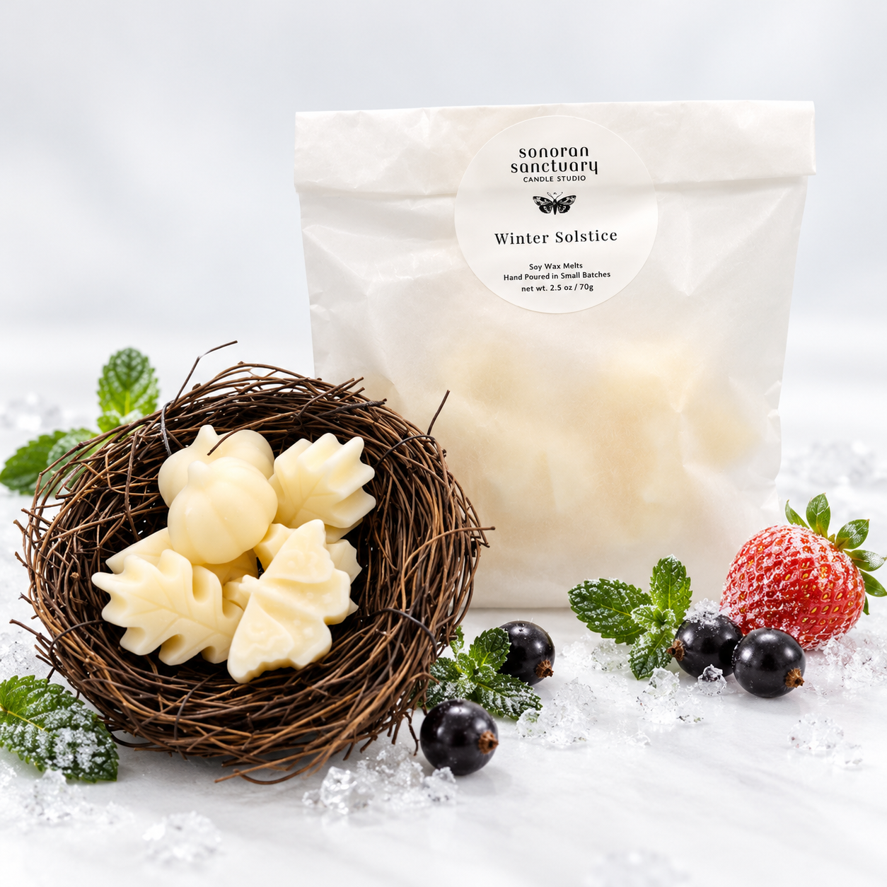 Sonoran Sanctuary Winter Solstice wax melts in branded packaging with botanical-shaped wax melts, fresh mint, black currants, frosted strawberry and ice crystals